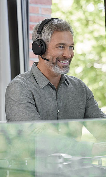 Male office worker wearing Jabra headset
