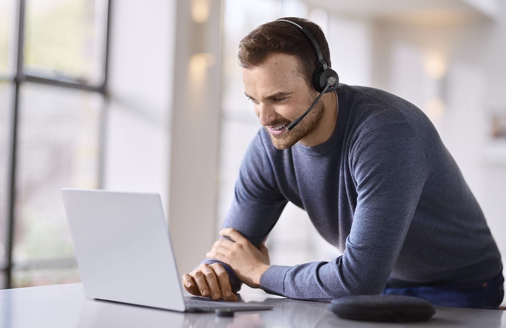 Male office worker wearing a Jabra Engage 55 headset