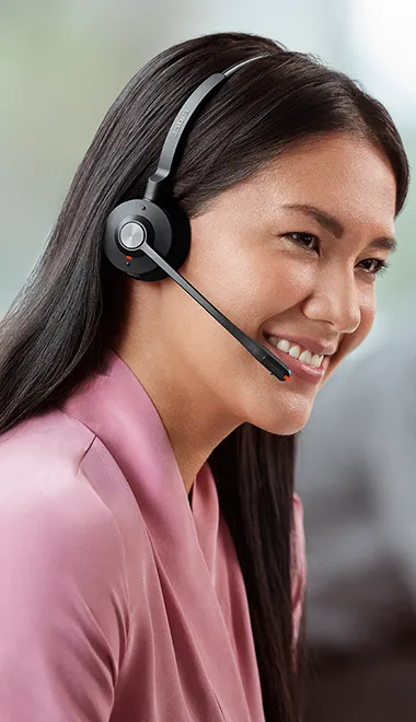 Female office worker wearing Jabra Engage 55 stereo headset